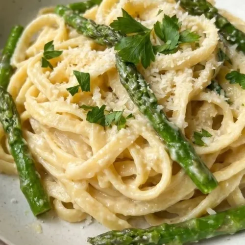 Lemon garlic asparagus pasta in a creamy sauce served in a bowl