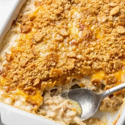 A fiercely bubbling million dollar chicken casserole completely covered in a deeply browned, intensely crispy toasted buttery cracker crust.